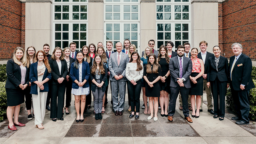the Randall Outstanding Undergraduate Research awards recipients stand as a group in front of the Bryant museum