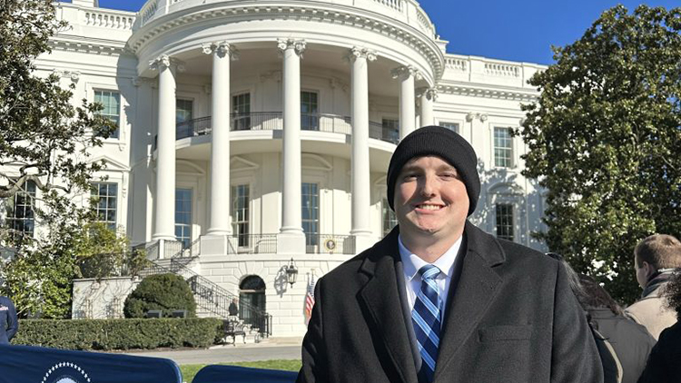 Austin Smithson standing in front of the White House
