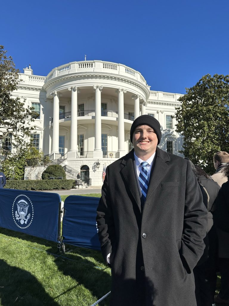 Austin Smithson standing in front of the White House
